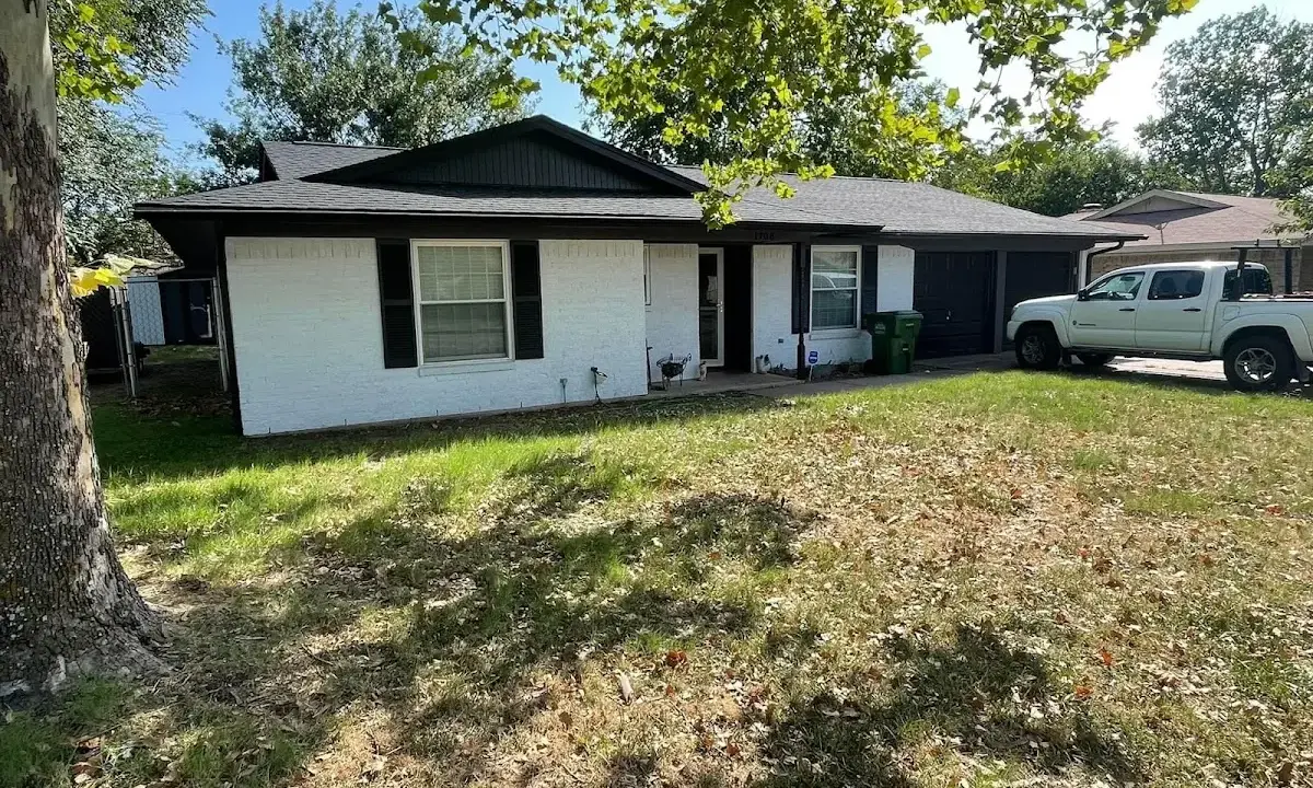 Professional roofing crew working on a residential roof in South Monrovia Island